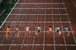 © kovop58 - Female track and Field athletes at 100 m hurdles. Dynamic sport photo. Sprint race before world championship and summer game in Paris 2024. Professional Athletics Event.