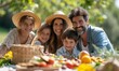 © Onchira - a family laughing around a picnic blanket, spread of summer fruits and sandwiches in the foreground