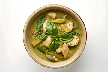 Wall Mural - Authentic Green Curry Chicken with Basil in a Bowl