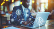 © ASSIASIA - Black man typing on laptop computer, human resources