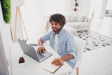 Canvas Print - Photo of cool good mood man wear checkered shirt online education modern gadget indoors house apartment room