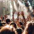 © Александр Лобач - Fans raised their hands in the air at the concert. A crowd of people with their hands in the air at a music festival