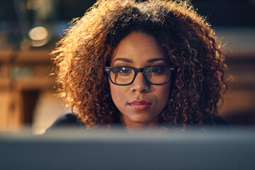 Sticker - Black businesswoman, working and late night with glasses on computer in evening for work deadline. Corporate, office and content writer or freelance with editing, blogging and script for career.