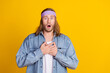 © deagreez - Photo portrait of attractive young hippie man touch chest frightened wear trendy denim outfit isolated on yellow color background