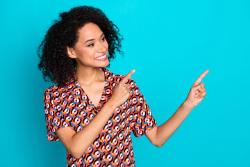 Poster - Photo of dreamy attractive lady dressed print shirt pointing finger looking empty space isolated turquoise color background