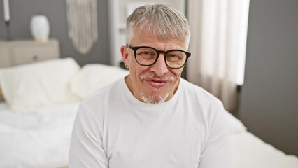 Canvas Print - Crazy fun in the bedroom, middle-aged grey-haired man in pyjamas making a comical fish face, a wacky gesture puckering his lips!