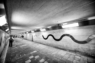 Wall Mural - Osaka, Japan - May 26, 2016: City underpass with local people