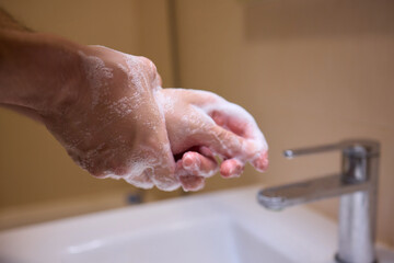 An automatic hand soap dispenser creates foam, promoting hygiene and cleanliness