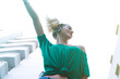 © FATIR29 - young cheerful woman dancing in the city and wearing headphones