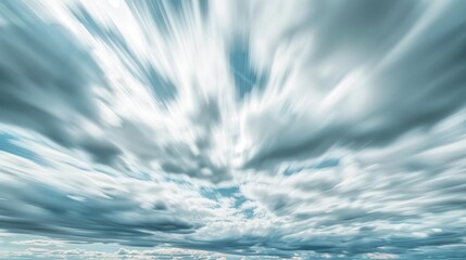 Daytime sky with streaks of clouds and an overcast sky