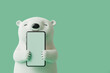 © ADDICTIVE STOCK - Polar bear cartoon hugging a blank mobile phone screen. Generative AI image