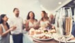 © anastasiia - Friends are having a party and celebrating something, people are blurred, and champagne is in front