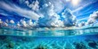 © surapong - Underwater perspective of blue ocean and sky with fluffy clouds, serene and peaceful scene