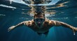 © SevenThreeSky - fit guy swimming on underwater background