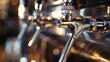 © 2rogan - Beer taps with shiny silver and black handles prepared for pouring