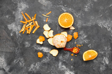 Wall Mural - Composition with fresh oranges and peel on grunge background
