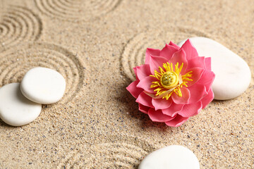 Wall Mural - White spa stones with flower on light sand