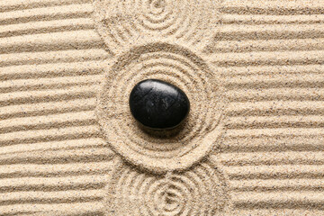 Wall Mural - Black stone on sand with pattern. Zen concept