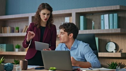 Wall Mural - Couple colleagues discussing startup in modern office closeup. Coworkers talking