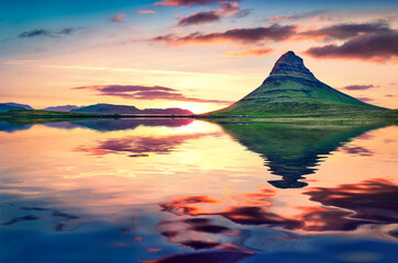 Poster - Kirkjufell peak reflected in the calm waters of Atlantic ocean. Majestic summer sunset in Snaefellsnes peninsula, Iceland, Europe. Beauty of nature concept background..