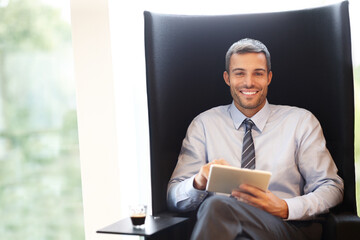 Canvas Print - Businessman, smile and sitting in office with tablet for crypto, easy investment with digital. Male trader, happiness and portrait for deal with blockchain tech, beat inflation and future in finance