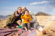 © DariaTrofimova - Portrait of a family of four on the beach in spring