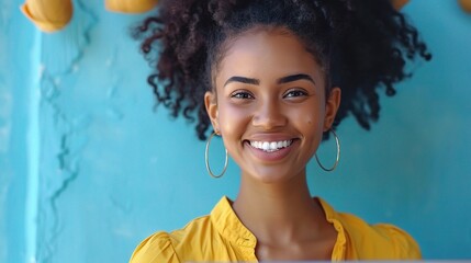 Canvas Print - Professional woman smiling with a laptop in hand, bright blue background