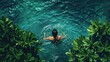 © RocknRoller Studios - Woman Swimming in Clear Blue Water - Refreshing Summer Escape