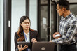 © M+Isolation+Photo - Young businesswoman and other Asian individuals are seen working at desks. Accountability, faultfinding, negligence, and other aspects of recruitment, staffing, and talent management being discussed.
