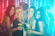 © Ruan Jordaan/peopleimages.com - Friends, woman and drinks in nightclub together, night life and fun for celebration or new years party with alcohol. Festival, disco lights and social or cheers with cocktails, enjoy and happy