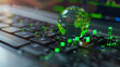 © Khajornyot - On the keyboard of the laptop, there is a green globe with stock graphs displayed on the laptop screen. This is a green business concept. Carbon efficient technology. Digital sustainability.
