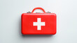 © ALA - Red first aid kit with a cross with medicines on a white background.