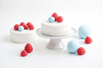 Poster - White cake with raspberries and blue eggs on white background