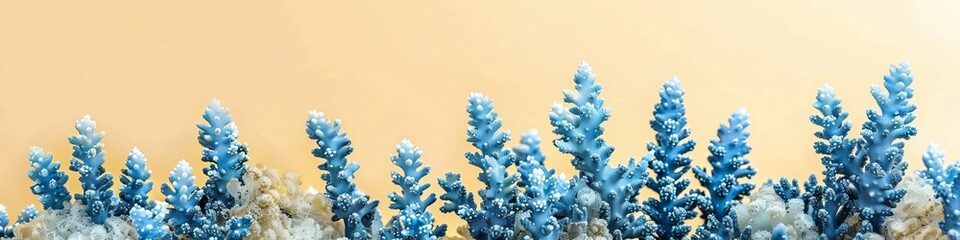 Wall Mural - blue corals on a light yellow background.