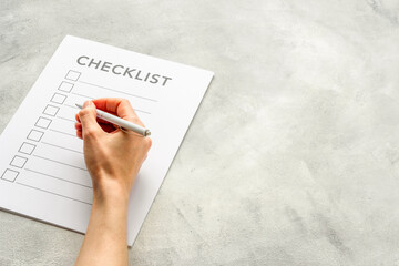 Checklist concept. Blank checklist with empty boxes on office table