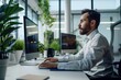 © KhairulHakimin - Professional working on a desktop computer in a modern office