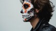 © Oksana Smyshliaeva - Day of the Dead Celebration: Profile Portrait of Person with Calavera Makeup