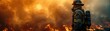 © Autaporn - Firefighter bravely battles raging wildfire, demonstrating courage and dedication amidst a fiery inferno, surrounded by intense flames and smoke.