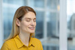 © Liubomir - Woman practicing mindfulness meditation with closed eyes, focusing on inner peace and relaxation in a serene office environment.