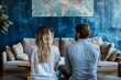 © AI Dev Studio - A man and woman sit comfortably looking at a large map art piece hanging on a blue textured wall