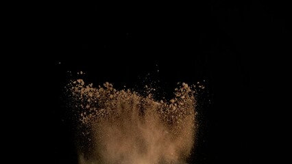Super Slow Motion Shot of Soil Explosion Isolated on Black Background at 1000fps.