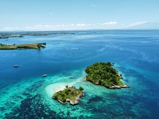 Wall Mural - an island in the ocean with several small islands surrounded by water