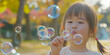 © smth.design - Adorable Toddler Blowing Bubbles in Autumn Park During Golden Hour