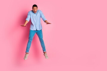 Sticker - Full length photo of attractive funny guy wear plaid shirt jumping falling emtpy space isolated pink color background