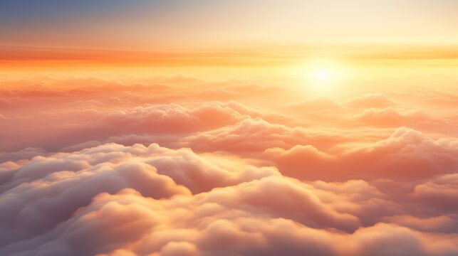 Gorgeous aerial view above the clouds, vibrant sunset with sunbeams cutting through the fog.