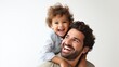 © BURIN93 - Portrait of a father carrying his laughing child on his shoulders, illustrating joy and playful connection Isolated white background, copy space