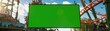 © pawimon - Amusement Park Ad Mockup Focus on an amusement park banner with a green screen with a roller coaster background, empty space right for text