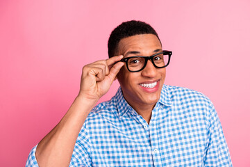 Sticker - Photo of attractive funny guy wear plaid shirt arm spectacles emtpy space isolated pink color background