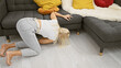 © Krakenimages.com - Beautiful young blonde woman frantically looking for something lost in the living room sofa at home, portraying a common indoor scene