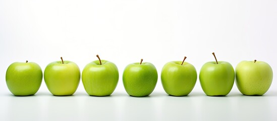 Poster - Green apples displayed against a white backdrop with copy space image.
